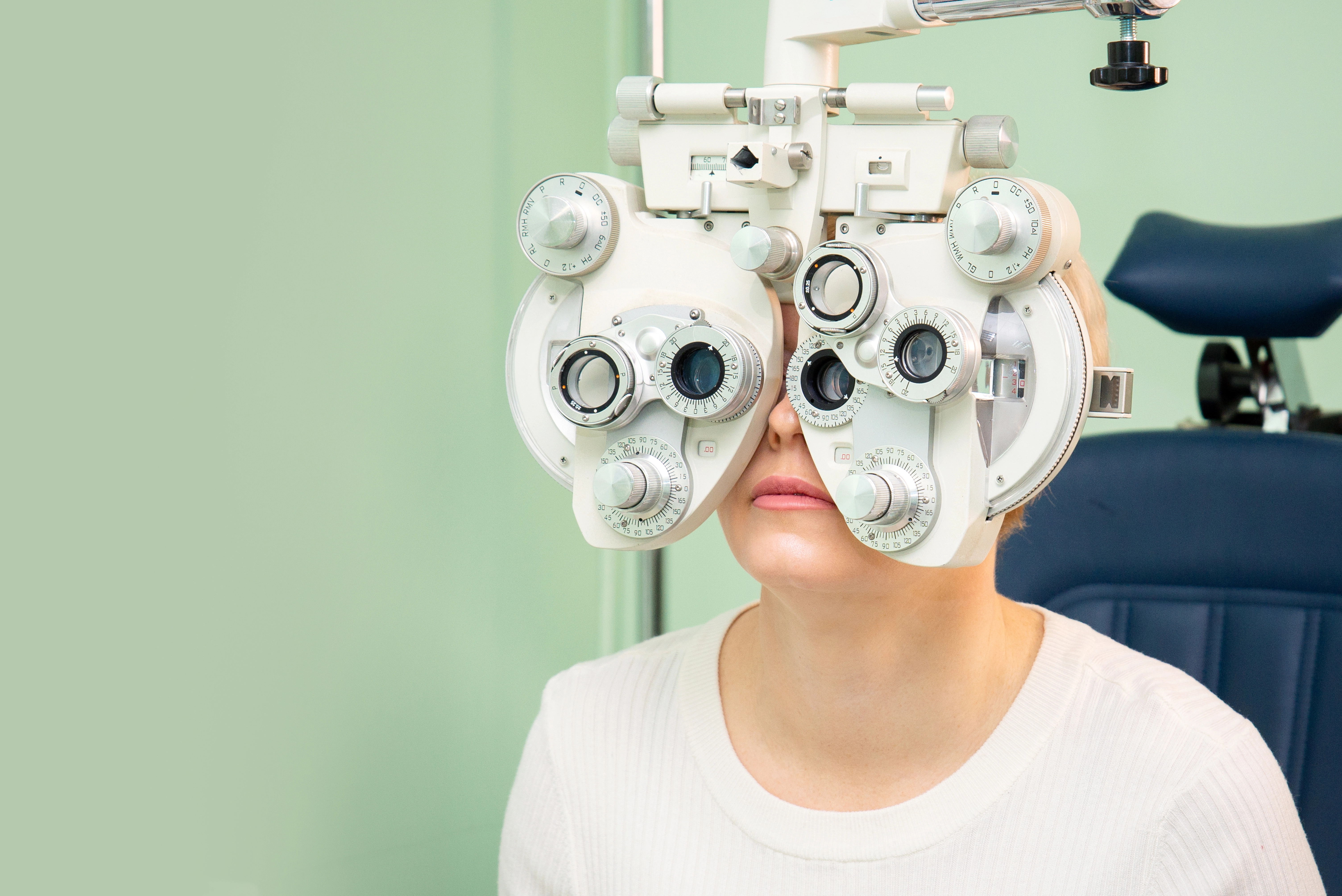Optometrist providing a routine vision exam